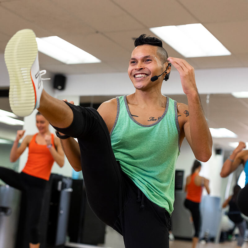 Male fitness instructor leading a class