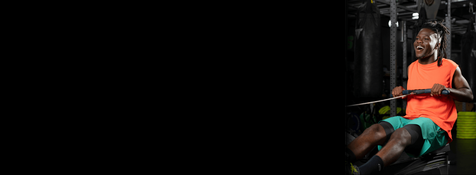 man on rowing machine at gym